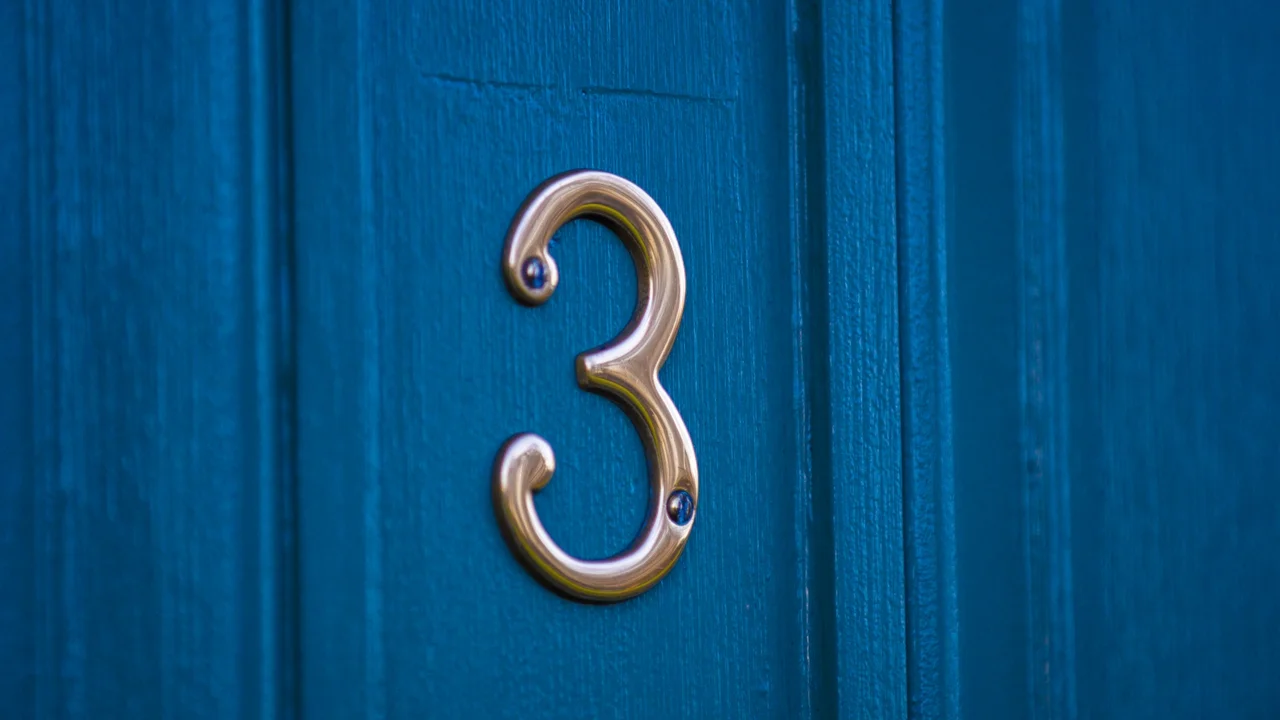 overhead view of corned beef sliced and on a platter with cabbage, potatoes, and carrots