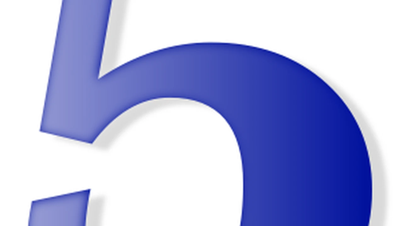 Two mint chocolate milkshakes with whipped cream and green sprinkles.