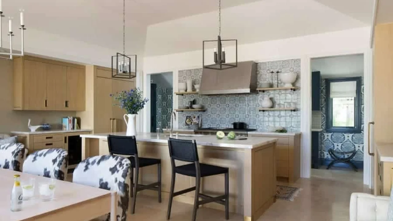 Close up on a plate of mashed potatoes, topped with baked pork chops with cream of mushroom soup, and a side of green beans.